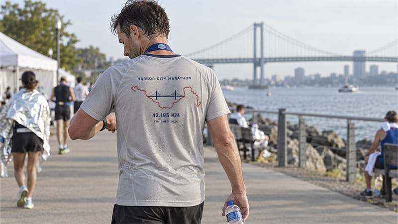 Marathon T-shirt design featuring race distance, route, and event details.