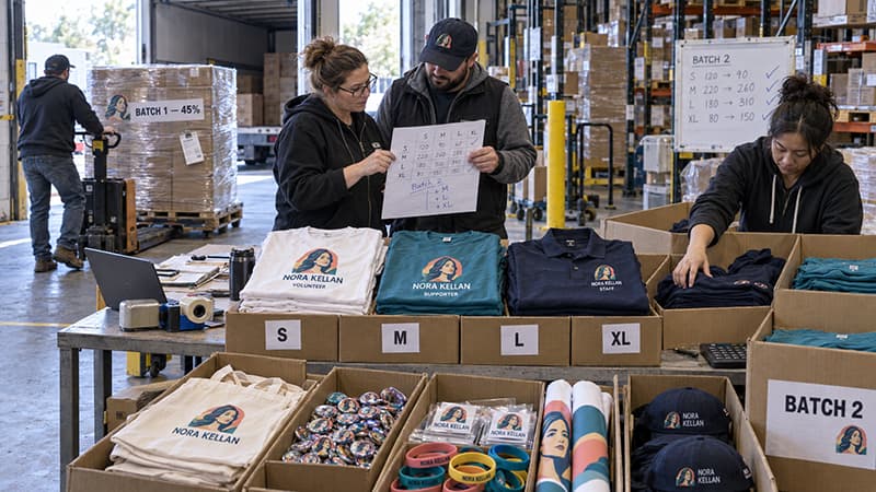 TOMASCRAFTS two-stage campaign merchandise order showing the first 45 percent batch being shipped and the second batch adjusted using actual apparel size data.